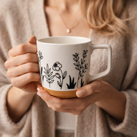 Cuire Floral Embossed Black & White Ceramic Coffee Mug with Brown Base | Mug for Him & Her | Perfect for Gifting | 450ml (Set of 1)