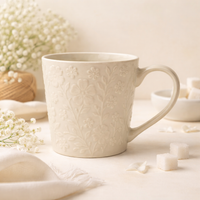 Cuire Floral Embossed White Ceramic Coffee Mug | Mug for Him & Her | Perfect for Gifting | 520ml (Set of 1)